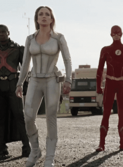 Woman In White Suit Next To Men In Red And Black Suits GIF