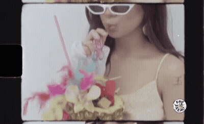 Woman In White Sunglasses Drinking From Straw GIF