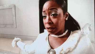 Woman In White Sweater And Pearl Necklace Making Funny Face GIF