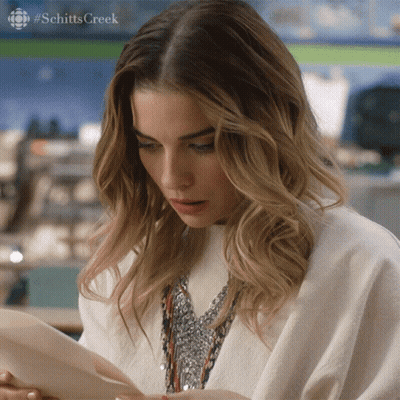 Woman In White Sweater Arms Up GIF
