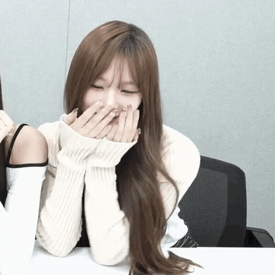 Woman In White Sweater Covering Mouth GIF