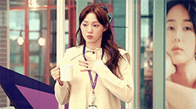 Woman In White Sweater Holding Coffee GIF