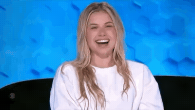 Woman In White Sweater Laughing GIF