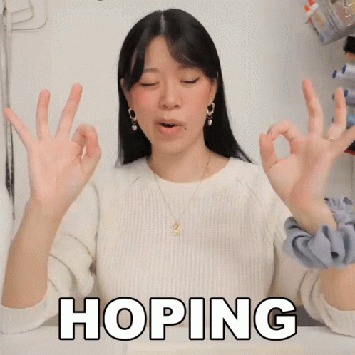 Woman In White Sweater Making OK Sign GIF