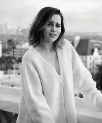 Woman In White Sweater On Balcony GIF