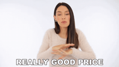 Woman In White Sweater Says Really Good Price Arms Outstretched GIF
