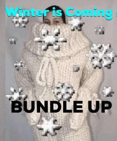 Woman In White Sweater Surrounded By Snowflakes Winter Is Coming Bundle Up GIF
