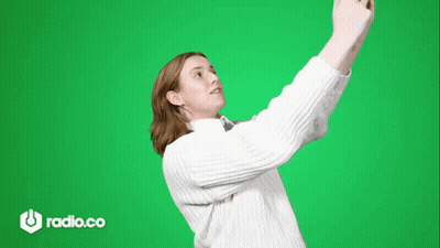 Woman In White Sweater Taking Selfie GIF