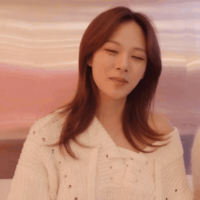 Woman In White Sweater With Holes GIF