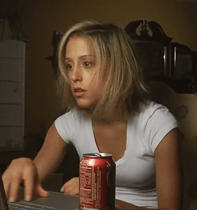 Woman In White T-Shirt Drinking From Can GIF
