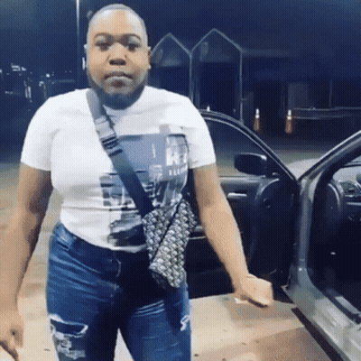 Woman In White T-Shirt In Front Of Car GIF