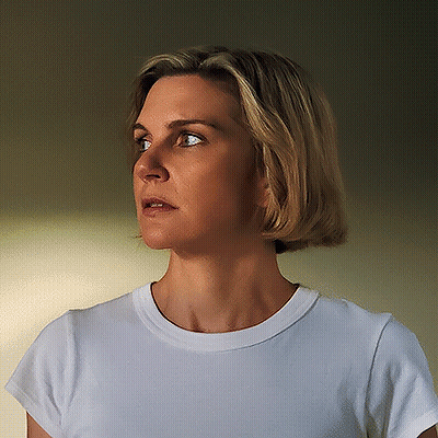 Woman In White T-Shirt Looking To The Side GIF
