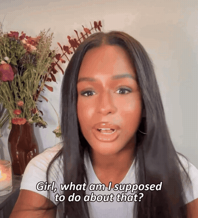 Woman In White T-Shirt Saying Girl What Am I Supposed To Do About That GIF