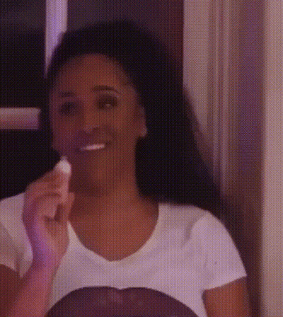 Woman In White T-Shirt Smiling Holding Toothbrush GIF