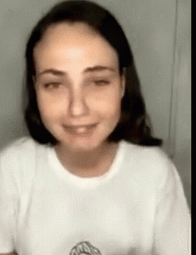 Woman In White T-Shirt Smiling GIF