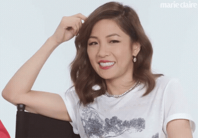 Woman In White T-Shirt With Marie Claire Logo GIF