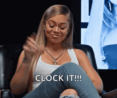 Woman In White Tank Top And Jeans Says Clock It GIF