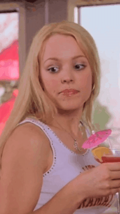 Woman In White Tank Top Holding Drink GIF