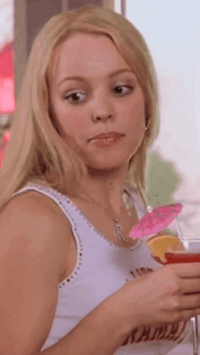 Woman In White Tank Top Holding Drink With Umbrella GIF
