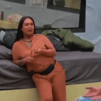 Woman In White Tank Top Kneeling Before Yellow Door GIF