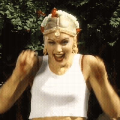 Woman In White Tank Top Making Fist GIF