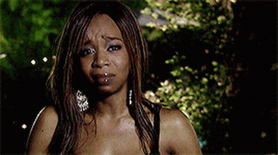 Woman In White Tank Top Next To Blonde Woman GIF