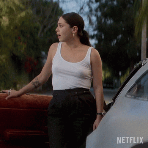 Woman In White Tank Top Next To Car With Netflix GIF
