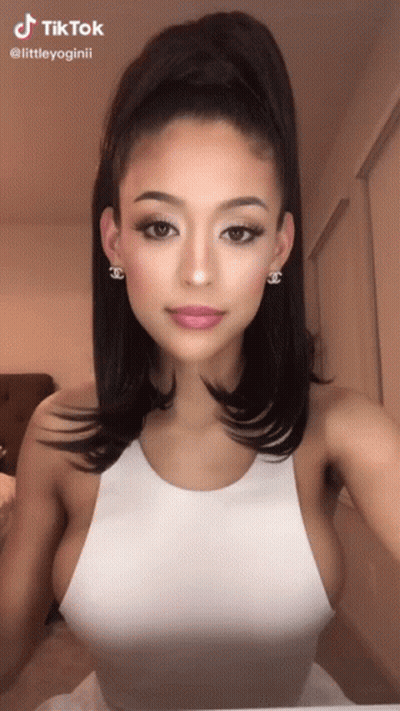 Woman In White Tank Top, Ponytail, Chanel Earrings GIF