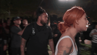 Woman In White Tank Top Punched By Man GIF