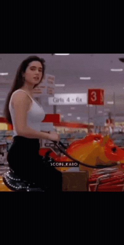 Woman In White Tank Top Riding Toy Horse GIF