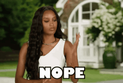 Woman In White Tank Top Saying Nope GIF