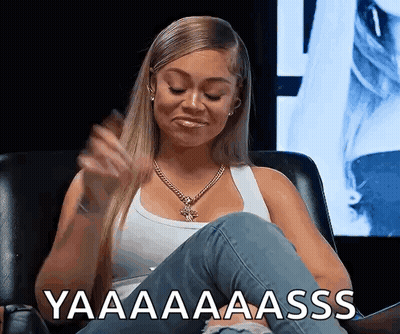 Woman in White Tank Top Sitting With Yaaaa Aaass Text