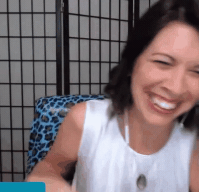 Woman In White Tank Top Smiling And Laughing GIF