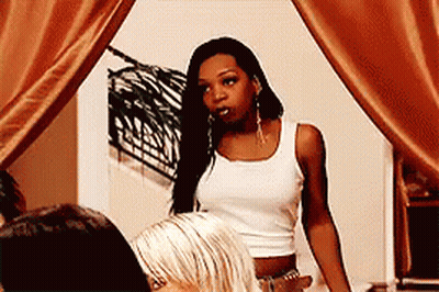 Woman In White Tank Top Standing With Other Women GIF