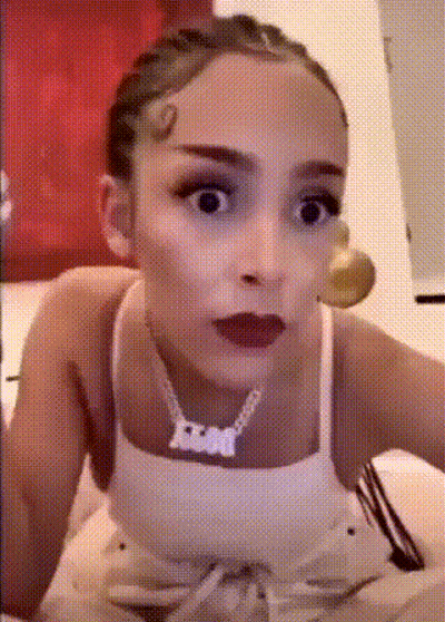 Woman In White Tank Top With Fox Necklace GIF