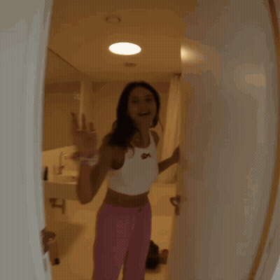Woman In White Tank Top With SDX GIF