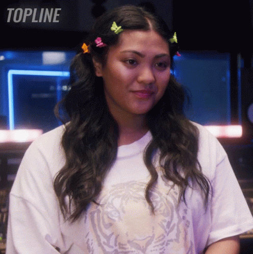 Woman In White Tiger T-Shirt In Front Of Topline Sign GIF