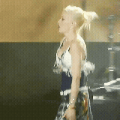 Woman In White Top And Blue Skirt GIF