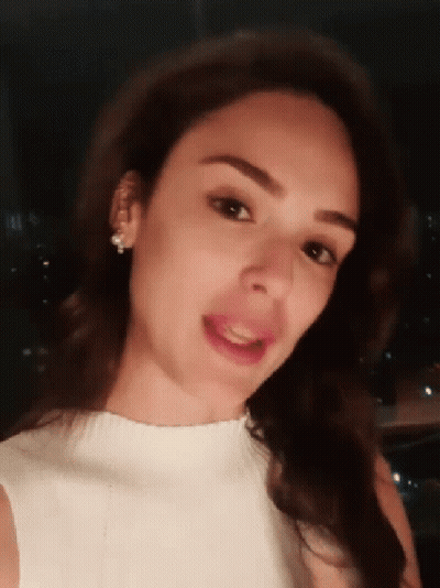 Woman In White Top And Earrings Smiling GIF
