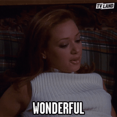 Woman In White Top Says Wonderful GIF