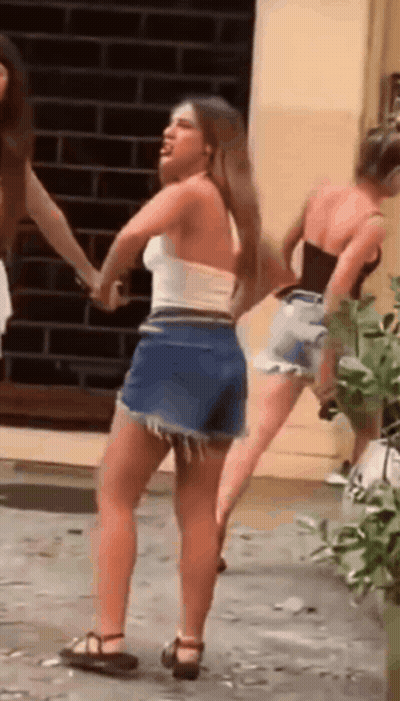Woman In White Top Shorts Dancing With Two Women GIF