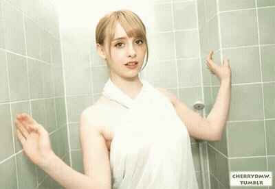 Woman In White Towel Leaning Against Green Tiled Wall With Cherrydmw Tumblr GIF