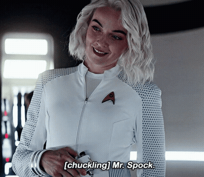 Woman In White Uniform Smiling Chuckling Mr. Spock GIF