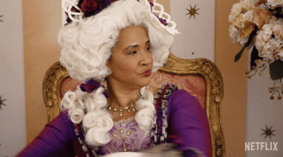 Woman In White Wig Sitting With Netflix Logo GIF