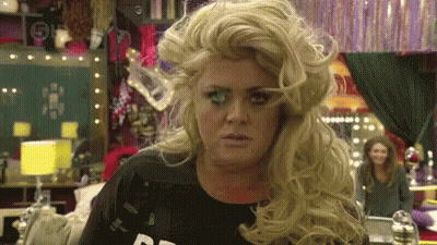 Woman In Wig And Black Shirt With Letter R GIF