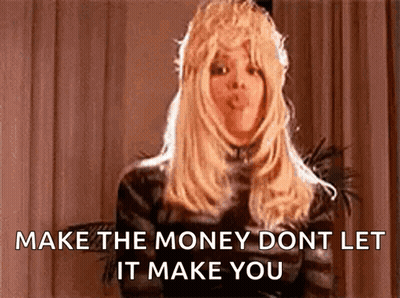 Woman In Wig Blowing Kiss Says Make The Money Dont Let It Make You GIF