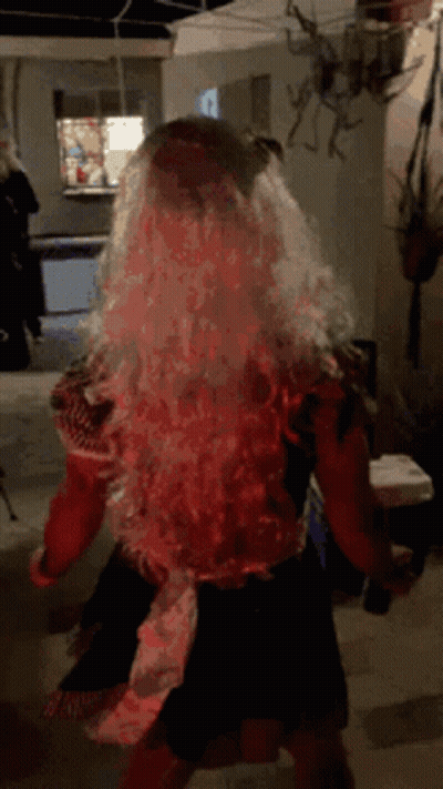 Woman In Wig Dancing In Dark Room GIF