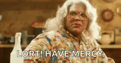 Woman In Wig Glasses Saying Lort Have Mercy GIF