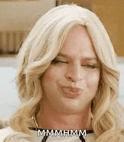 Woman In Wig Making Funny Face GIF