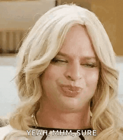 Woman In Wig Making Funny Face GIF